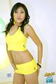 Wearing yellow crop top in short skirt