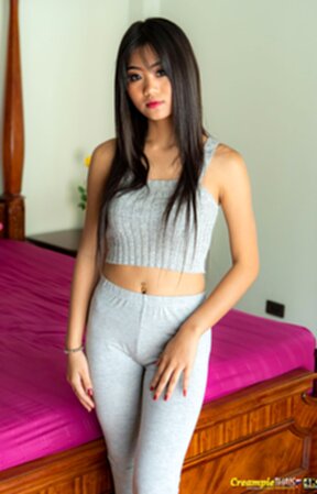 Kyu strips top and pants and poses nude in white high heels