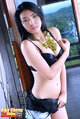 Riko chong with arm across her chest wearing black bra