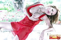 Cherry Chen cupping breasts in red lingerie