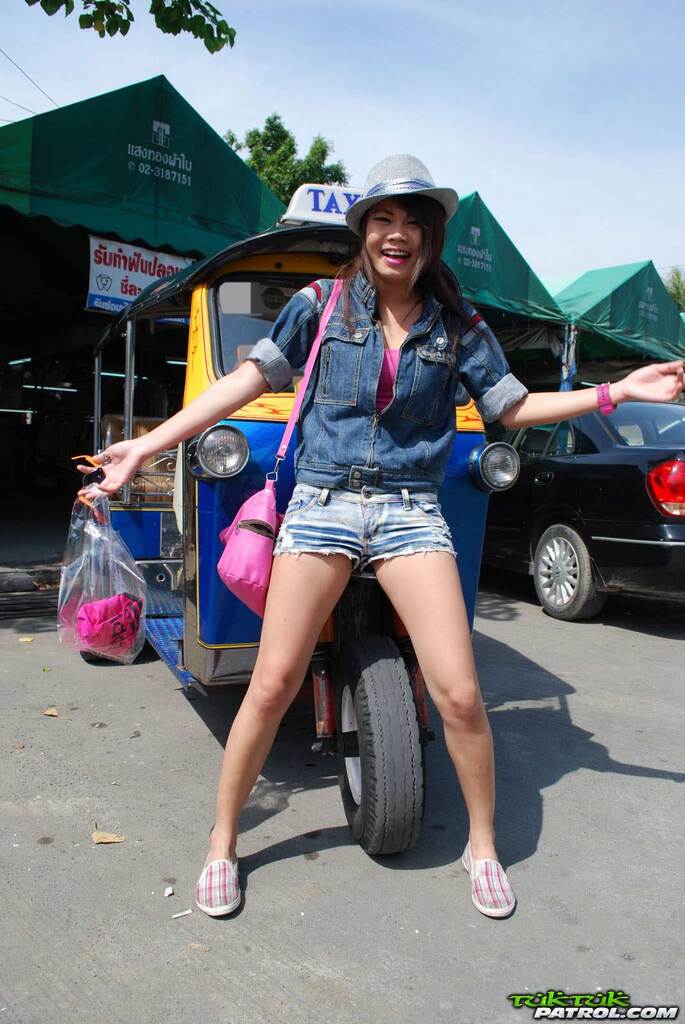Standing in front of tuktuk